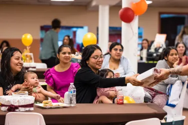 Women accepting donation 